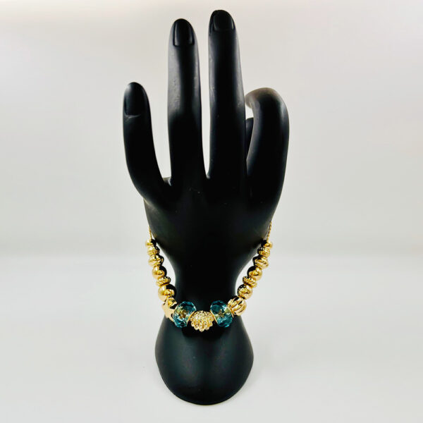 Golden Harmony: Blue Zircon Dangle Bracelet